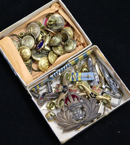 A collection of military badges and buttons